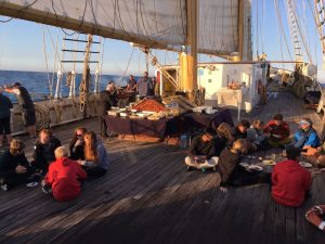 Photo of Santa Maria Manuela trainees enjoying their meal on deck