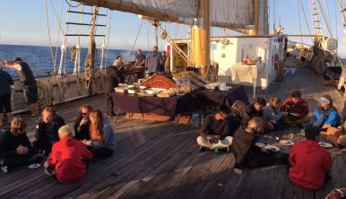 Photo of Santa Maria Manuela trainees enjoying their meal on deck